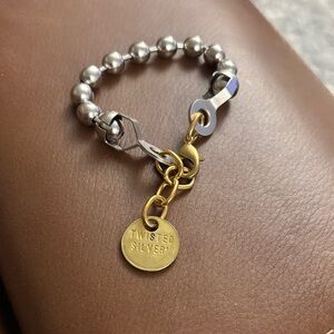 Twisted Silver Beaded Bracelet with Gold Charm